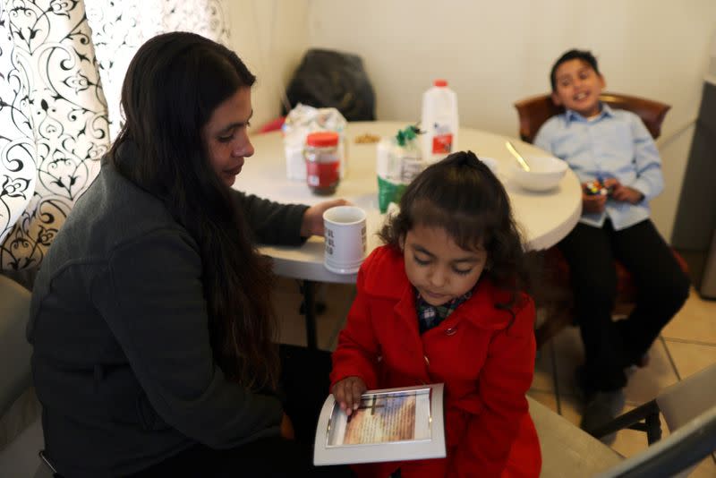 Emiliana, 32, eats breakfast with her son, Leonardo, 10, and daughter, Emily, 5, at their apartment in Los Angeles