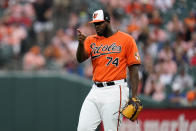 Baltimore Orioles relief pitcher Felix Bautista gestures at third baseman Ramon Urias after he made a play on a ball hit by Los Angeles Angels designated hitter Shohei Ohtani during the eighth inning of a baseball game, Saturday, July 9, 2022, in Baltimore. The Orioles won 1-0. (AP Photo/Julio Cortez)