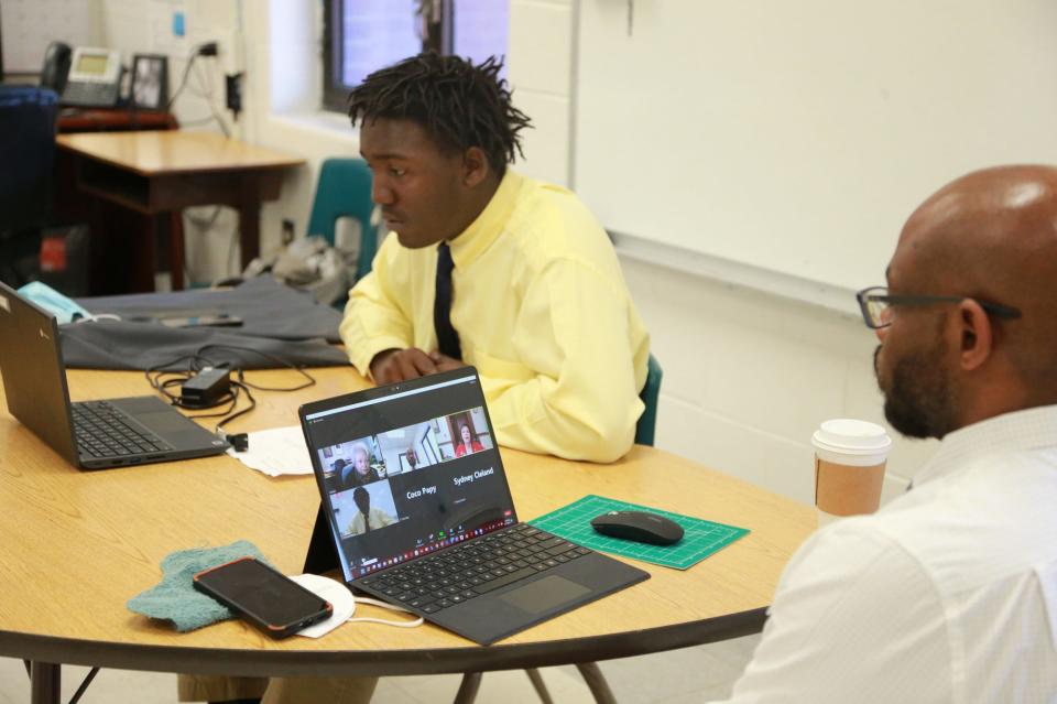 Rahmell, a member of the Deep Center Work Readiness Enrichment Program, speaks with Georgia State legislators during a virtual meeting along with Life Navigator Opollo Johnson.