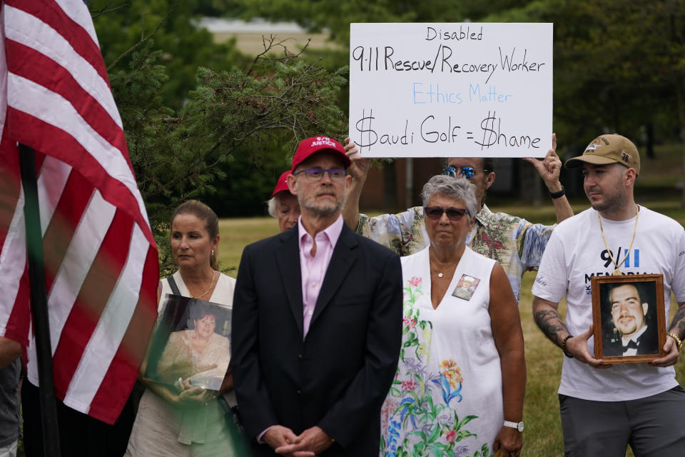 Families and survivors of the 9/11 terror attacks attend a news conference near the site of the Bedminster Invitational LIV Golf tournament in Bedminster, NJ., Friday, July 29, 2022. Like the Saudi-backed LIV Golf league, critics describe the 2022 World Cup, which starts Sunday, as a classic case of “sportswashing” — using sports to change a country or company's image. (AP Photo/Seth Wenig, File)