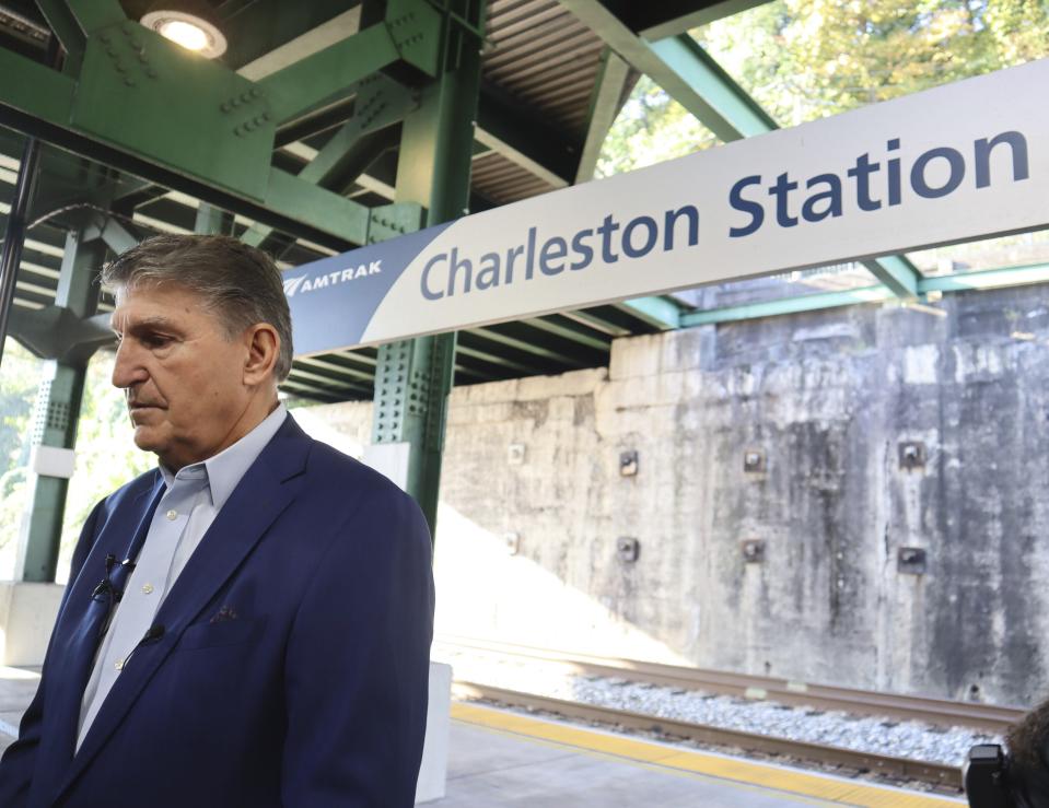 West Virginia Democratic Sen. Joe Manchin speaks with reporters outside the newly renovated Amtrak train station in Charleston, W.Va. on Thursday, Oct. 12, 2023 (AP Photo/Leah Willingham)