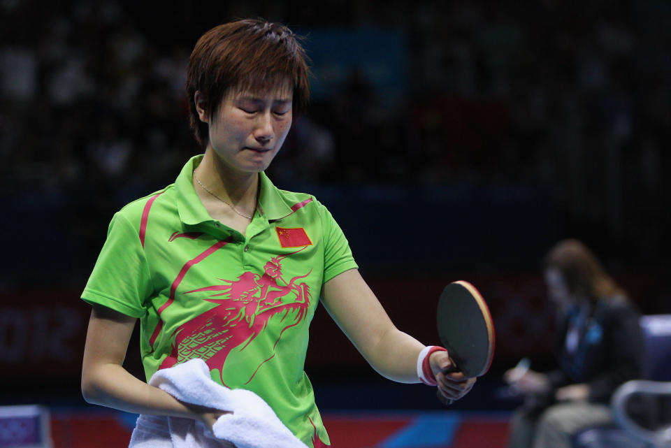 Ning Ding of China cries after the Women's Singles Table Tennis Gold Medal match against Xiaoxia Li of China on Day 5 of the London 2012 Olympic Games at ExCeL on August 1, 2012 in London, England. (Photo by Feng Li/Getty Images)