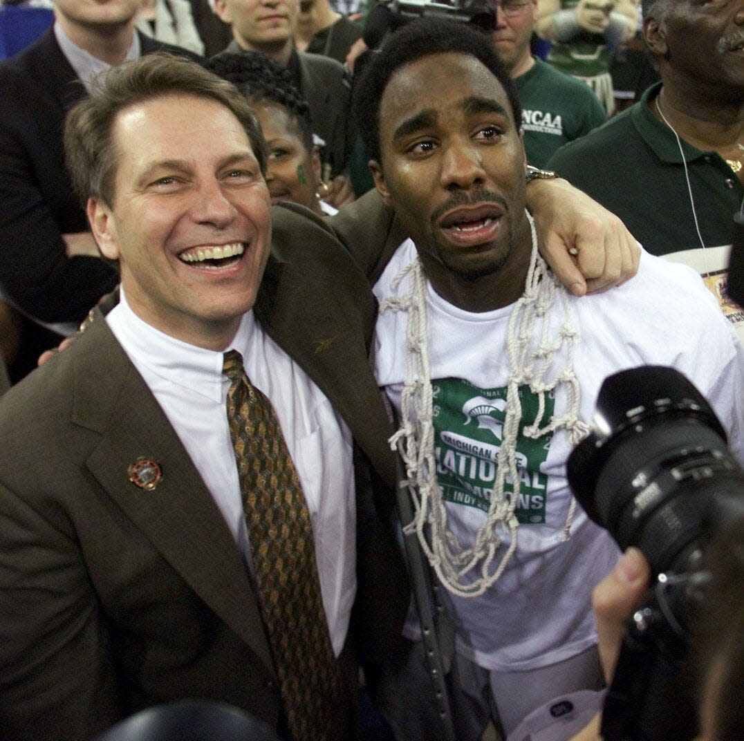 A tearful Mateen Cleaves celebrates with Tom Izzo after Michigan State defeated Florida to win the NCAA championship in 2000.