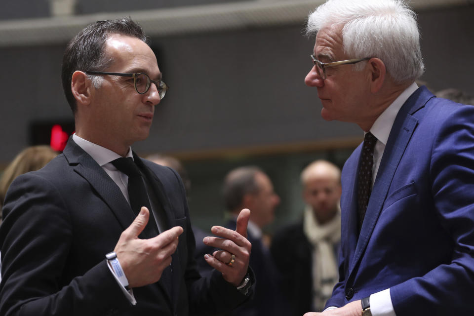 Germany's Foreign Minister Heiko Maas, left, talks to his Poland counterpart Jacek Czaputowicz prior a meeting of EU Foreign Affairs ministers at the European Council headquarters in Brussels, Monday, Dec. 10, 2018. (AP Photo/Francisco Seco)