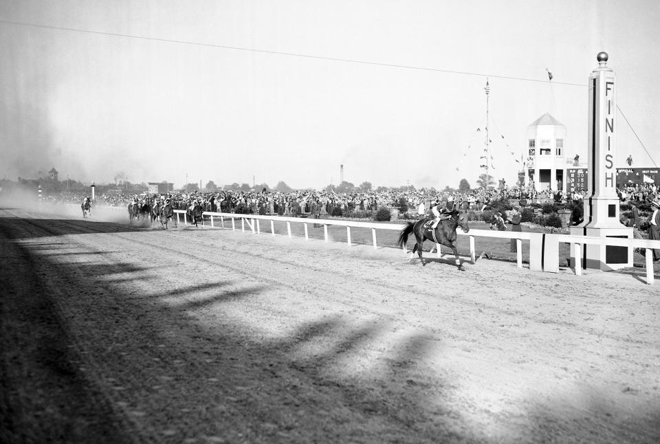 FILE - Whirlaway, Eddie Arcaro up, nears the finish line of the Kentucky Derby horse race at Churchill Downs in Louisville, Ky., May 3, 1941. What is the largest margin of victory in the Derby? (AP Photo/File)