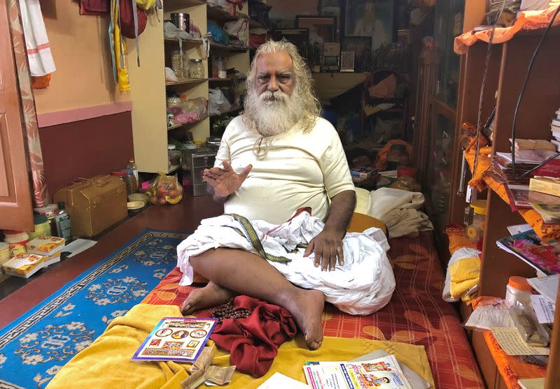 FILE PHOTO: Nritya Gopal Das poses for a picture after speaking with Reuters at a temple in Ayodhya in Uttar Pradesh