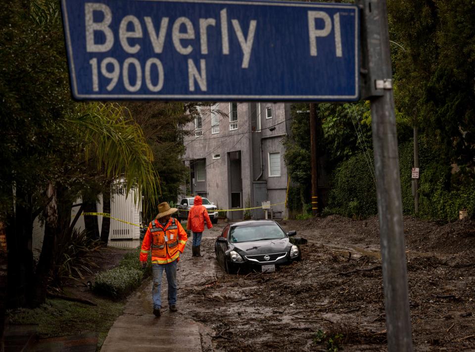 Workers survey a mudslide Tuesday, Feb. 6, 2024, in the Beverly Crest area of Los Angeles (Copyright 2024 The Associated Press. All rights reserved)