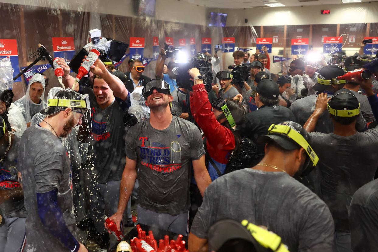 Texas Rangers celebrate in the locker room after winning the 2023 World Series.