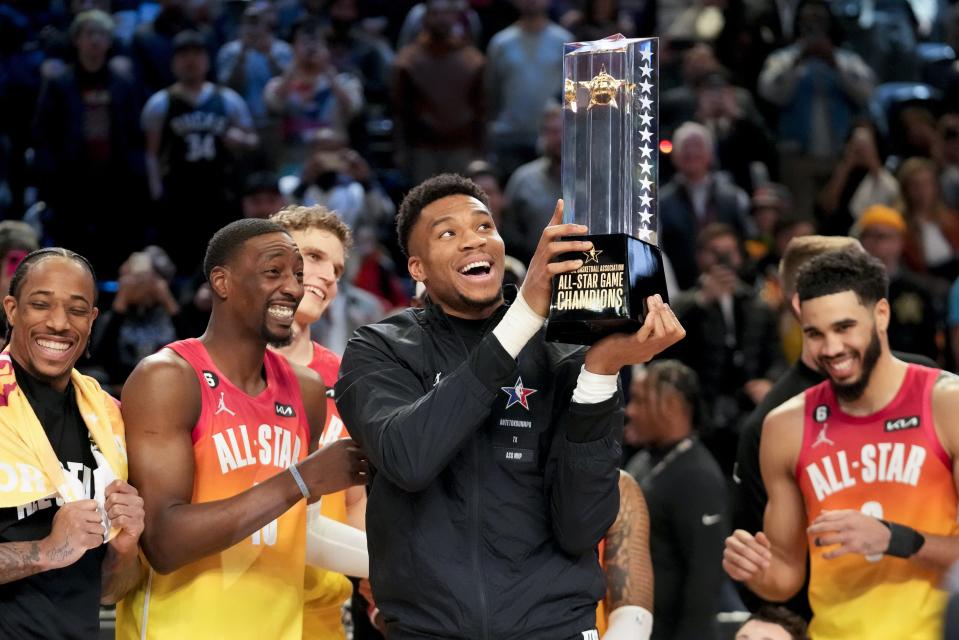 Giannis Antetokounmpo hold up the winning team trophy after the NBA basketball All-Star game Sunday, Feb. 19, 2023, in Salt Lake City. (AP Photo/Rick Bowmer)