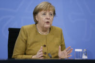 German Chancellor Angela Merkel addresses a press conference following talks via video conference with Germany's state governors on extending coronavirus restrictions at the Chancellery in Berlin, Wednesday, Nov. 25, 2020. Merkel and the country’s 16 state governors have agreed to extend a partial shutdown well into December in an effort to further reduce the rate of coronavirus infections ahead of the Christmas period. Germany embarked on a so-called “wave-breaker” shutdown on Nov. 2, initially slated to last four weeks. (Odd Andersen/Pool Photo via AP)