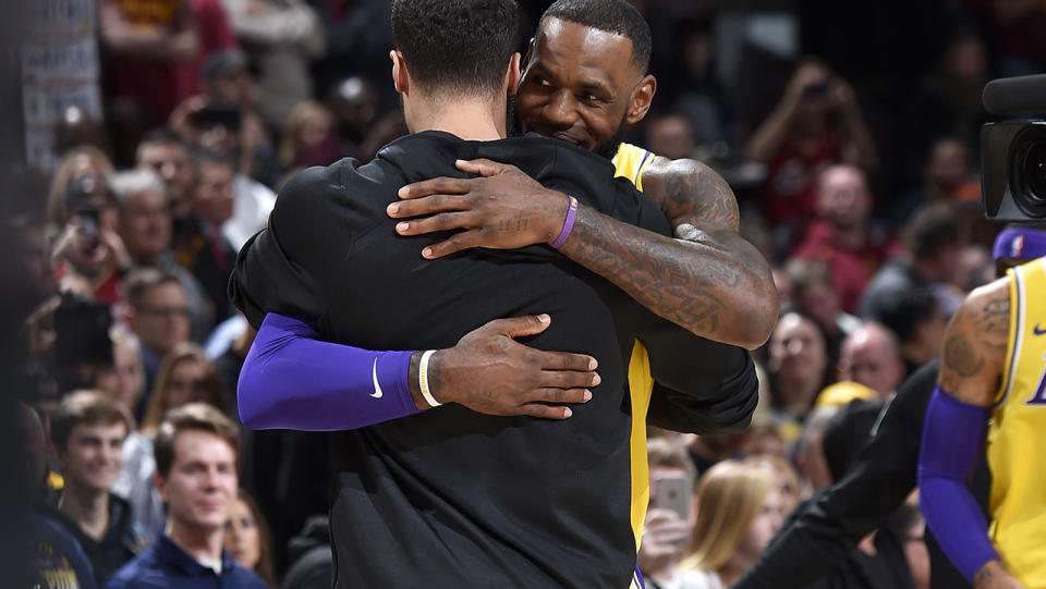 LeBron James and Larry Nance hug before the game. (Photo by David Liam Kyle/NBAE via Getty Images)