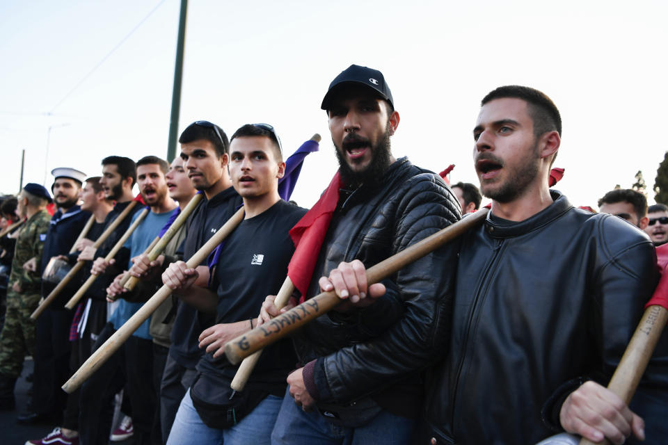 Protesters chant slogans during a rally in Athens, Friday, Nov. 17, 2023. Thousands of people are marching through central Athens to mark the 50th anniversary of a pro-democracy student uprising that was violently put down by the military dictatorship ruling Greece in 1973. (AP Photo/Michael Varaklas)