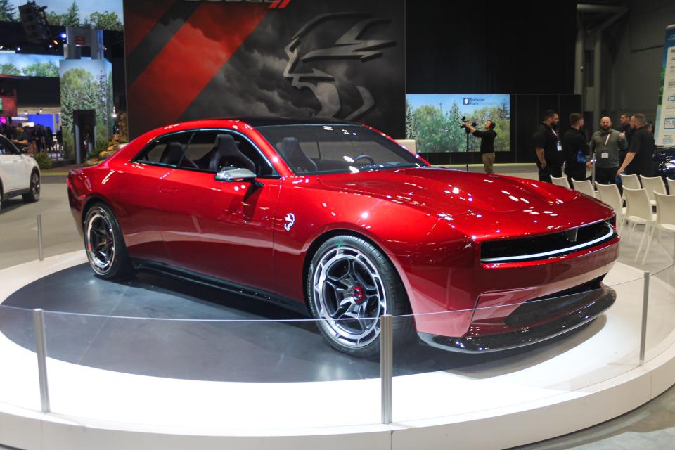 A red Dodge Charger Daytona SRT concept muscle car.