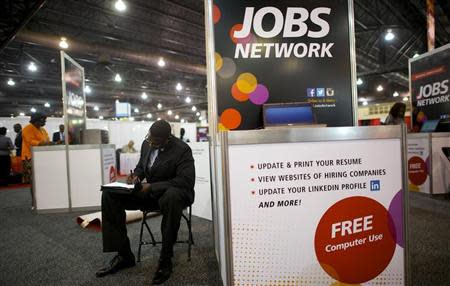 A job-seeker completes an application at a career fair held by civil rights organization National Urban League as part of its annual conference, in Philadelphia July 25, 2013. REUTERS/Mark Makela