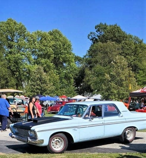 The 1963 Plymouth Fury owned by Evan Derry is seen with its black hood.