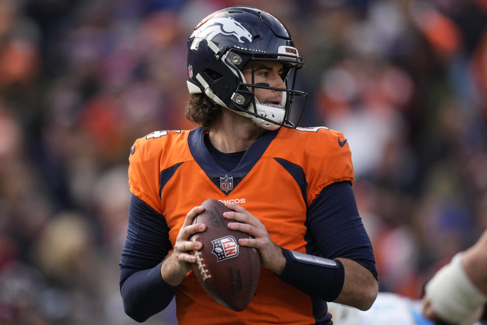 Denver Broncos quarterback Jarrett Stidham (4) looks to pass against the Los Angeles Chargers during the first half of an NFL football game, Sunday, Dec. 31, 2023, in Denver. (AP Photo/David Zalubowski)