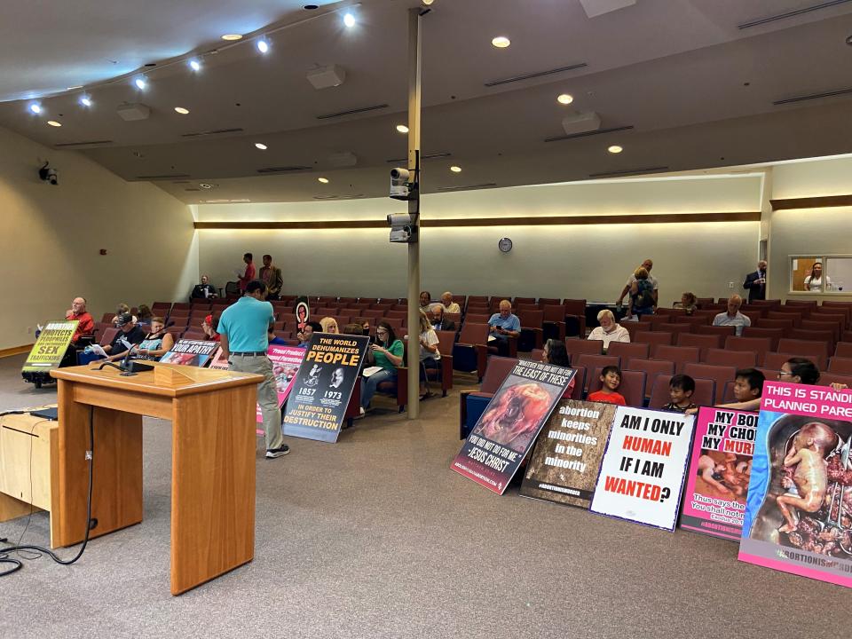 Santa Rosa County residents on Tuesday listen as the Santa Rosa County Commission discusses a "trigger ban" ordinance that would prohibit abortion clinics from operating in the county.