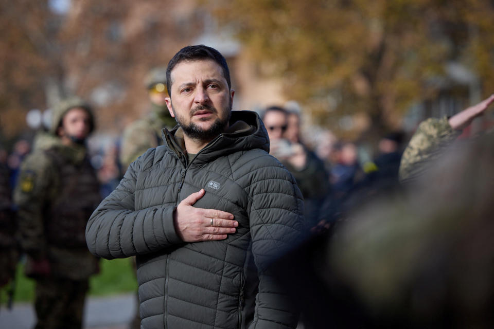 Ukraine's President Volodymyr Zelenskiy sings the national anthem during his visit in Kherson, Ukraine November 14, 2022.  Ukrainian Presidential Press Service/Handout via REUTERS ATTENTION EDITORS - THIS IMAGE HAS BEEN SUPPLIED BY A THIRD PARTY.