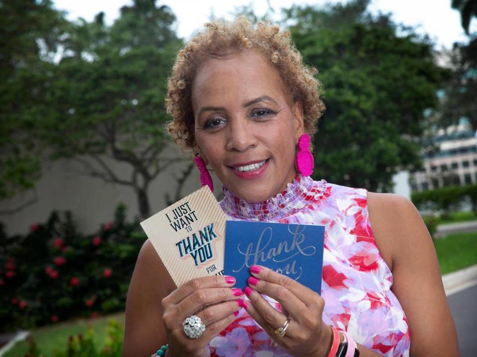 Angela Taylor, a breast cancer survivor and patient of Dr. Lauren Carcas, was treated at Baptist Health’s Miami Cancer Institute Plantation location. On Oct. 8, 2021, Taylor holds thank you notes she has received from others she has helped through their illness.