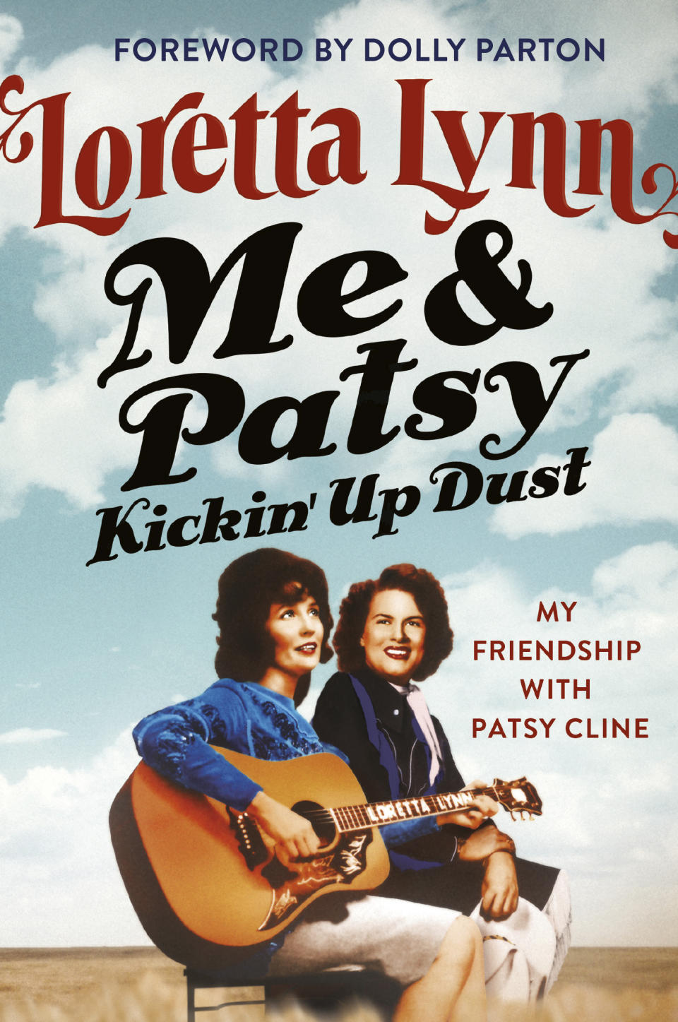 This cover image released by Grand Centra shows "Me & Patsy Kickin’ Up Dust: My Friendship with Patsy Cline" by Loretta Lynn. (Grand Central via AP)