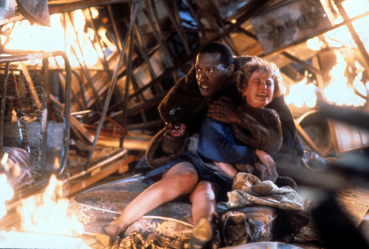 Tony Todd holds onto Virginia Madsen in a scene from the film 'Candyman', 1992. (Photo by TriStar/Getty Images)