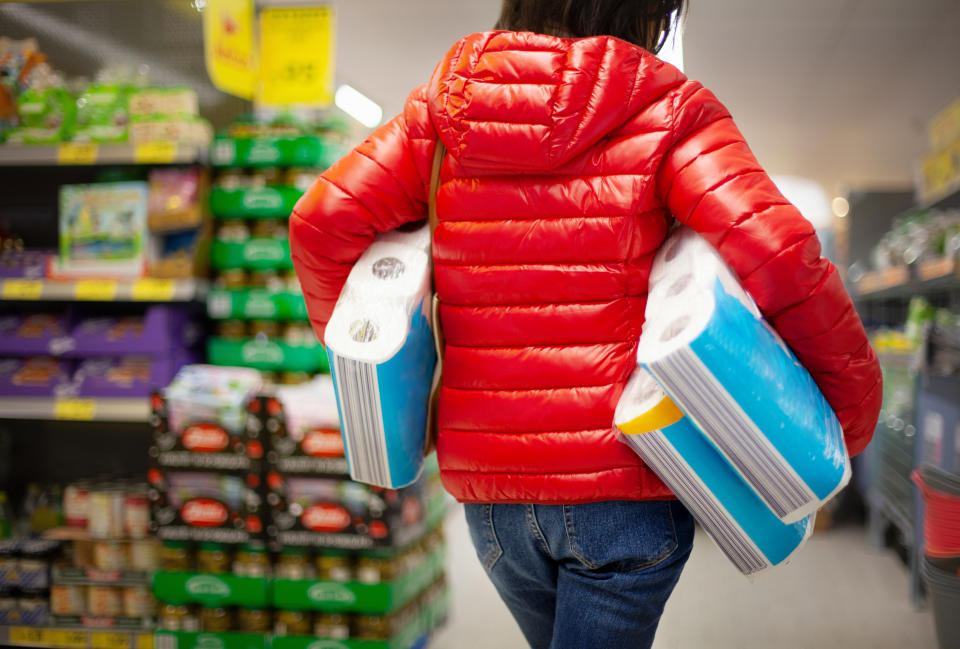 Customer hoarding paper towels during the coronavirus crisis in Germany