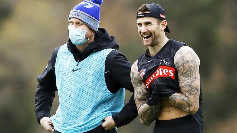 Nathan Buckley and Jeremy Howe, pictured here at Collingwood's training session on Friday.