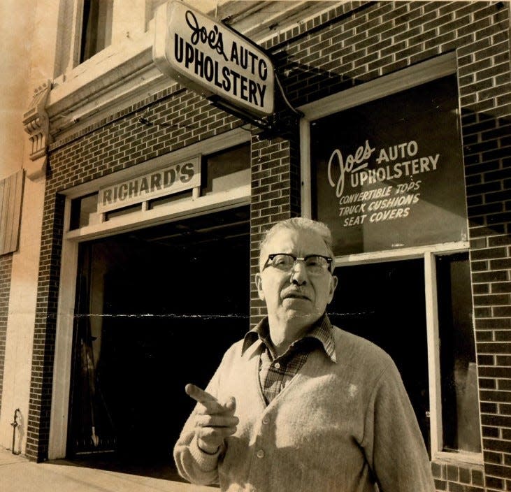 Joe Cienfuegos Sr. standing outside Joe's Auto Upholstery, 247 Linden St., in early 1981. Cienfuegos purchased the building around 1952 and ran Joe's Auto Upholstery there until retiring in the mid-1980s.