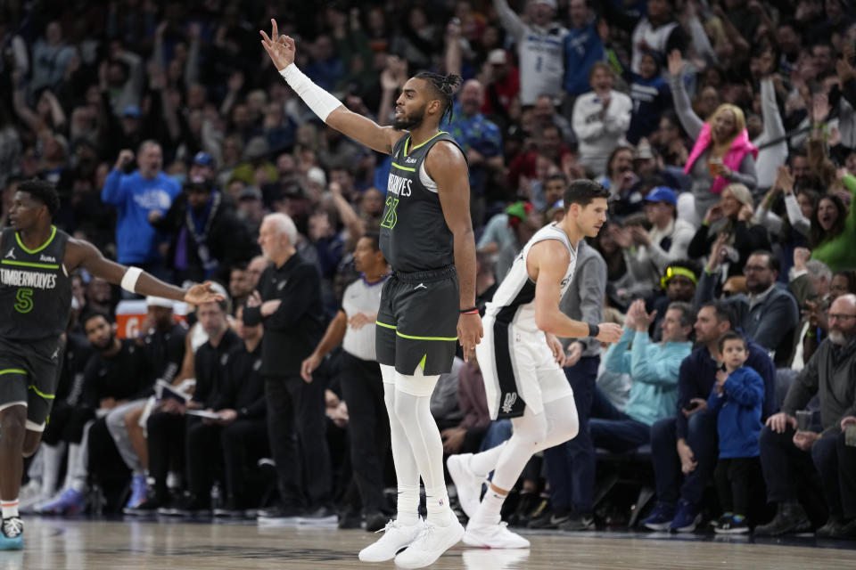 Minnesota Timberwolves forward Troy Brown Jr. (23) celebrates after making a three-point basket during the second half of an NBA basketball game against the San Antonio Spurs, Wednesday, Dec. 6, 2023, in Minneapolis. (AP Photo/Abbie Parr)