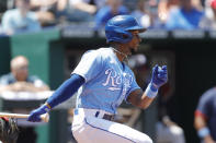Kansas City Royals' Jarrod Dyson hits a two-RBI double in the third inning of a baseball game against the Boston Red Sox at Kauffman Stadium in Kansas City, Mo., Sunday, June 20, 2021. (AP Photo/Colin E. Braley)