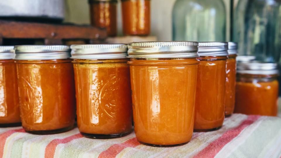 jars of peach jam on table