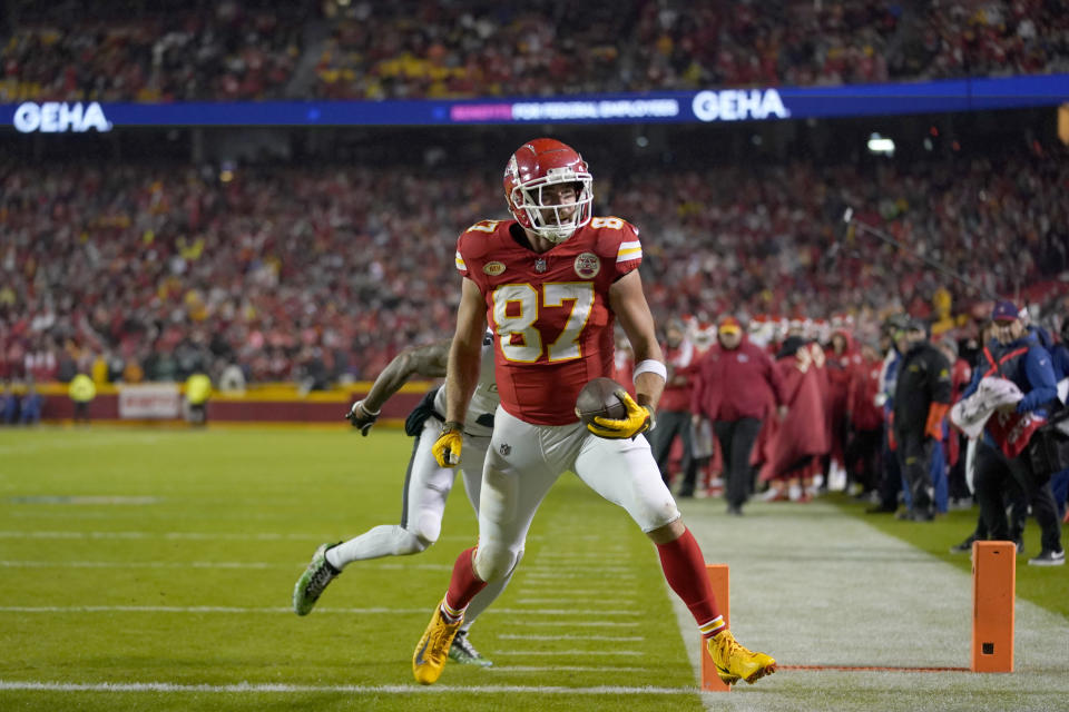 Kansas City Chiefs tight end Travis Kelce scores during the first half of an NFL football game against the Philadelphia Eagles, Monday, Nov. 20, 2023, in Kansas City, Mo. (AP Photo/Ed Zurga)