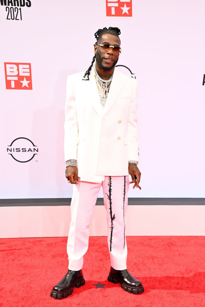 Burna Boy attends the BET Awards 2021 in a white suit