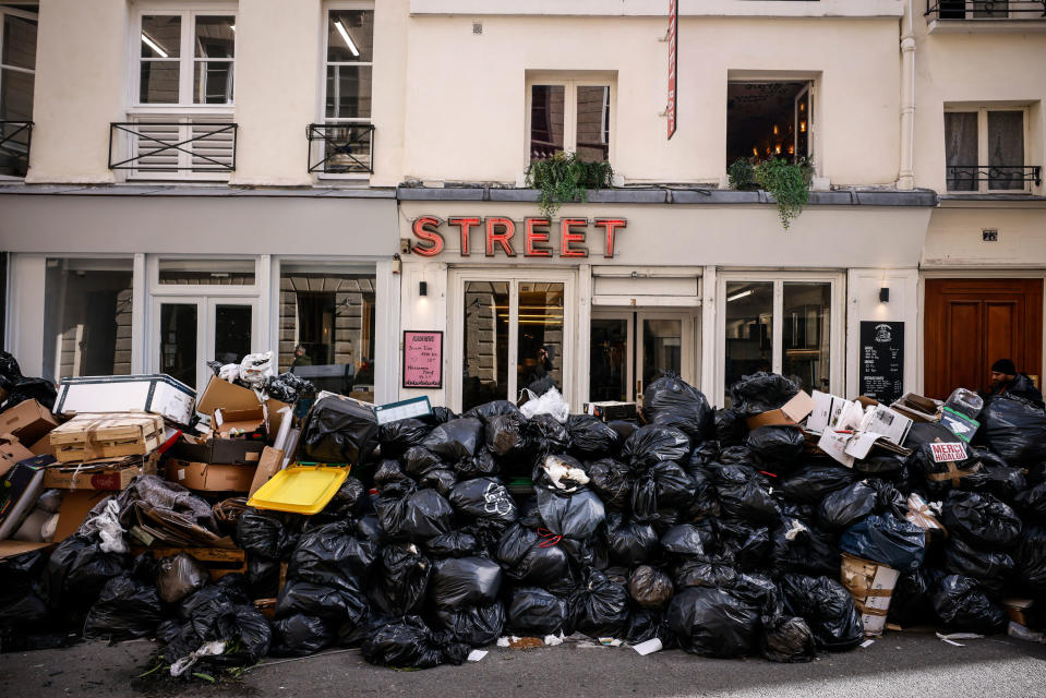 Uncollected garbage is piled up on a street in Paris during an ongoing strike by sanitation workers, on March 15, 2023.<span class="copyright">Thomas Padilla—AP</span>