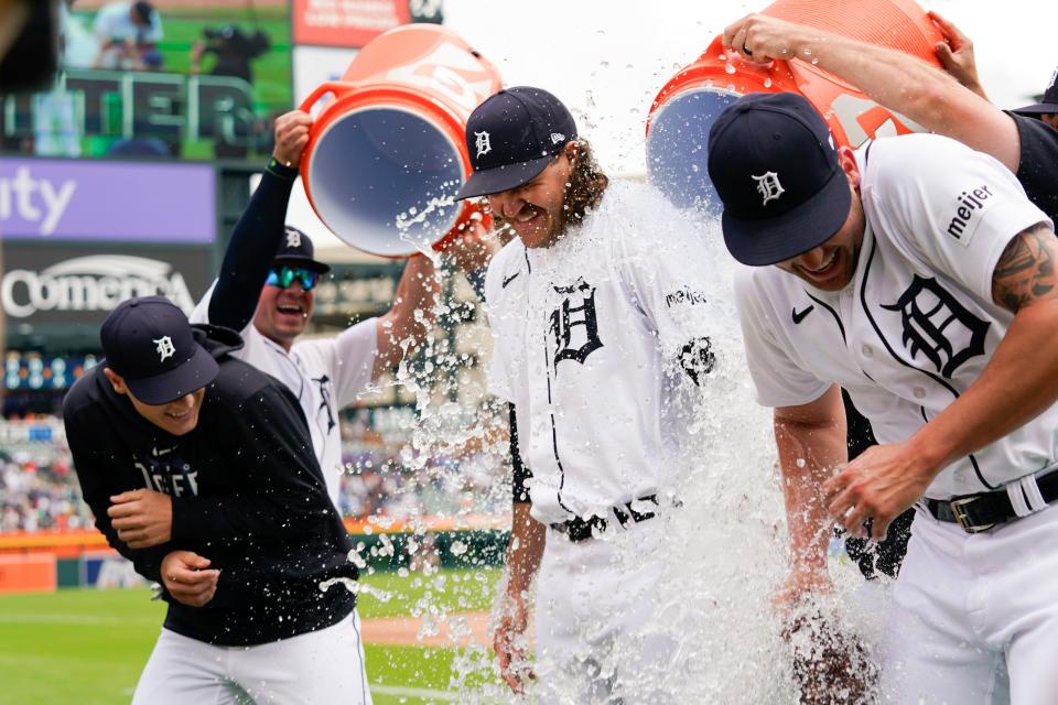 Detroit Tigers pitcher Matt Manning, left, Jason Foley, center, and Alex Lange, right, have water poured on them after a baseball game against the Toronto Blue Jays, Saturday, July 8, 2023, in Detroit. The three pitchers combined to no-hit the Toronto Blue Jays in a 2-0 win.