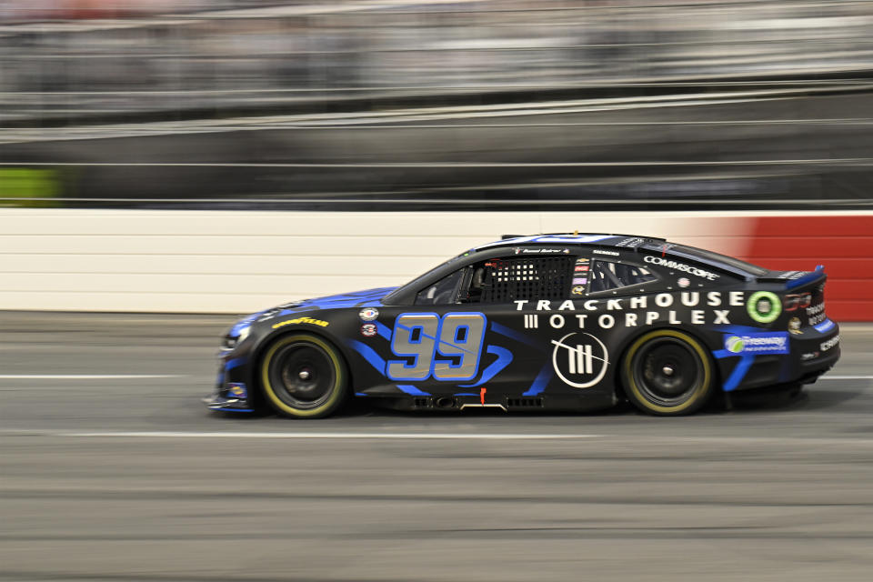 Daniel Suarez (99) steers into Turn 3 during the NASCAR All-Star Cup Series auto race at North Wilkesboro Speedway, Sunday, May 21, 2023, in North Wilkesboro, N.C. (AP Photo/Matt Kelley)