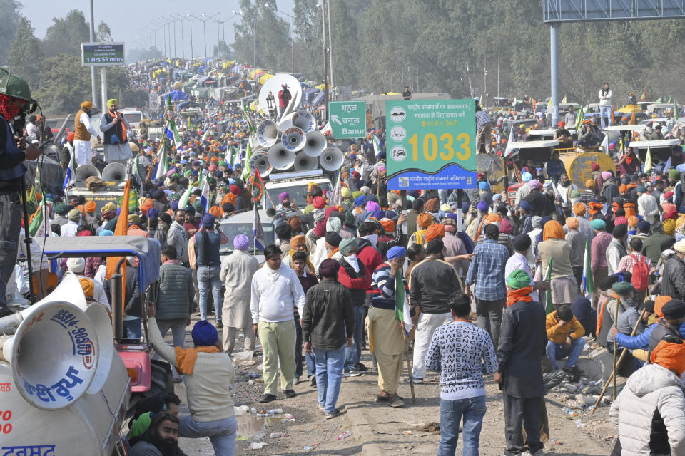 Protesting farmers gather near Shambhu border that divides northern Punjab and Haryana states, almost 200 km (125 miles) from New Delhi, India, Wednesday, Feb.14, 2024. Protesting Indian farmers Wednesday clashed with police for a second consecutive day as tens of thousands of them tried to march to the capital New Delhi to demand guaranteed crop prices for their produce. (AP Photo/Rajesh Sachar)