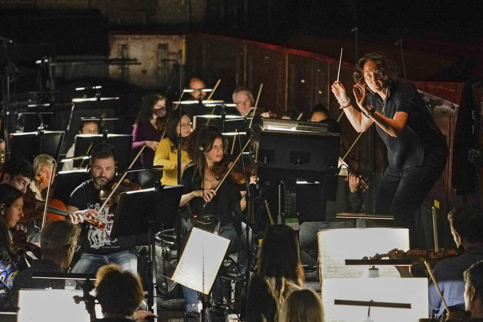 Nathalie Stutzmann conducts a recent orchestra rehearsal, Wednesday, April 26, 2023, in New York. Stutzmann gave up a quarter-century career as a contralto to become a conductor and makes her Metropolitan Opera debut in a new production of Mozart's "Don Giovanni" on Friday night. (Courtesy of the Metropolitan Opera via AP)