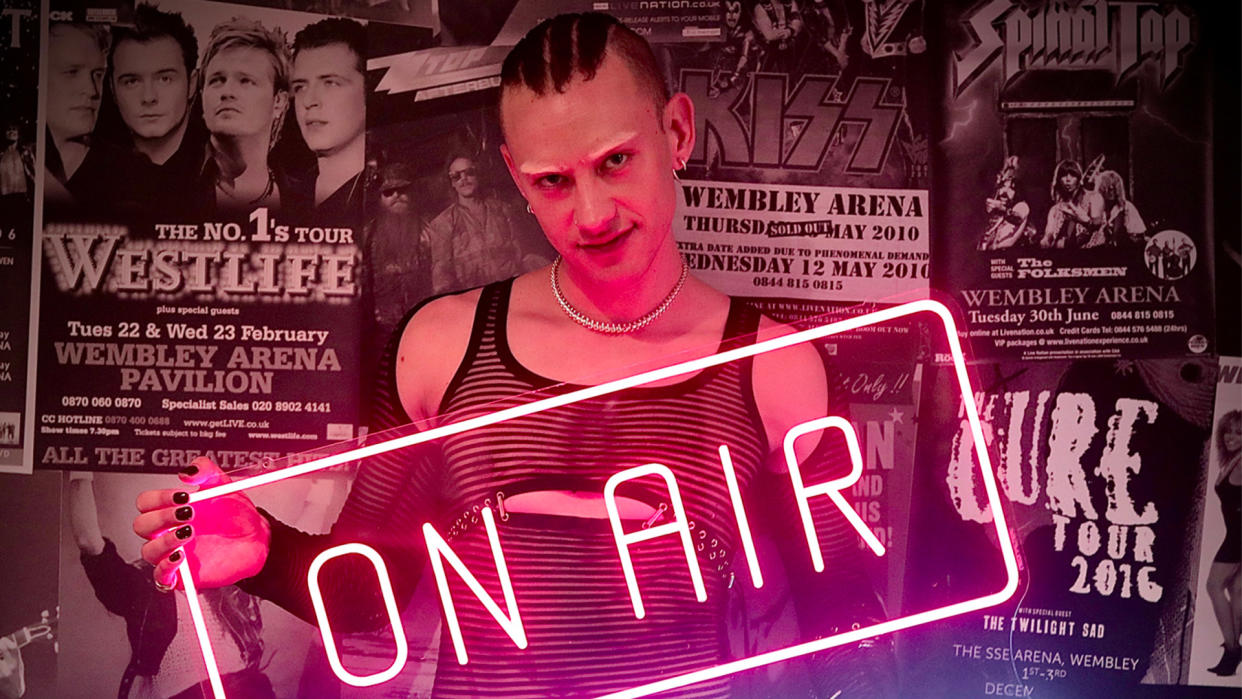  Olly Alexander from Years & Years holding an On Air neon sign  