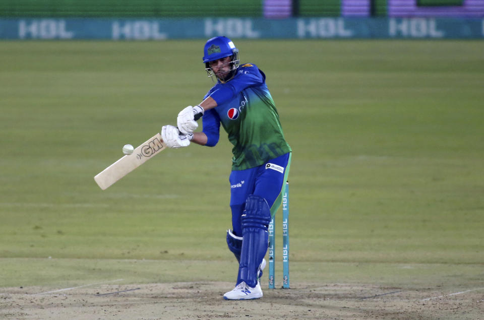 Multan Sultans' James Vince plays a shot during a Pakistan Super League T20 cricket match between Multan Sultans and Peshawar Zalmi at the National Stadium, in Karachi, Pakistan, Tuesday, Feb. 23, 2021. (AP Photo/Fareed Khan),