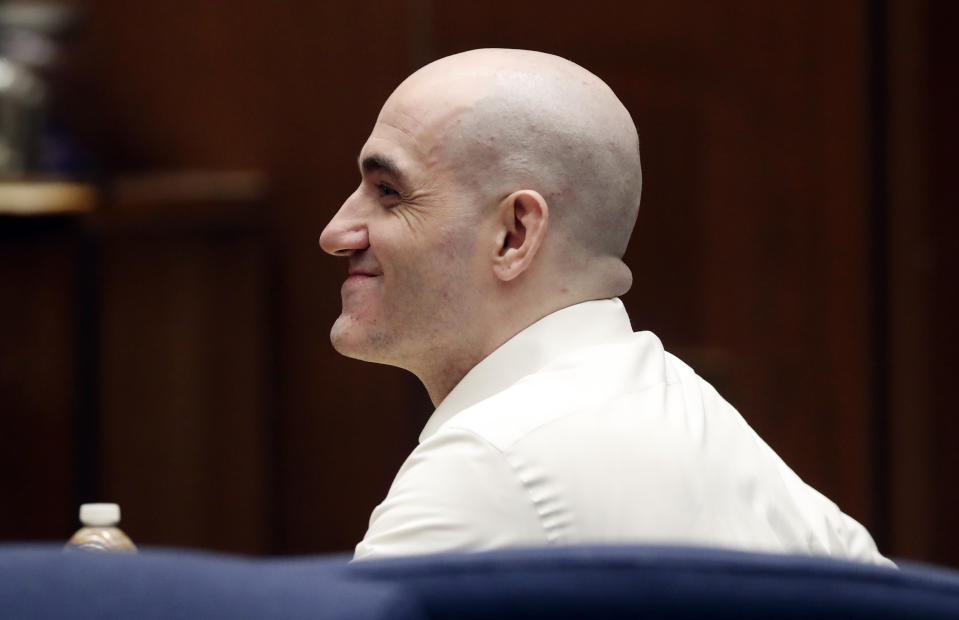 Michael Gargiulo smiles during a court appearance Tuesday, Aug. 6, 2019, in Los Angeles. Closing arguments started Tuesday in the trial of an air conditioning repairman charged with killing two Southern California women and attempting to kill a third. (Lucy Nicholson, Pool Photo via AP)