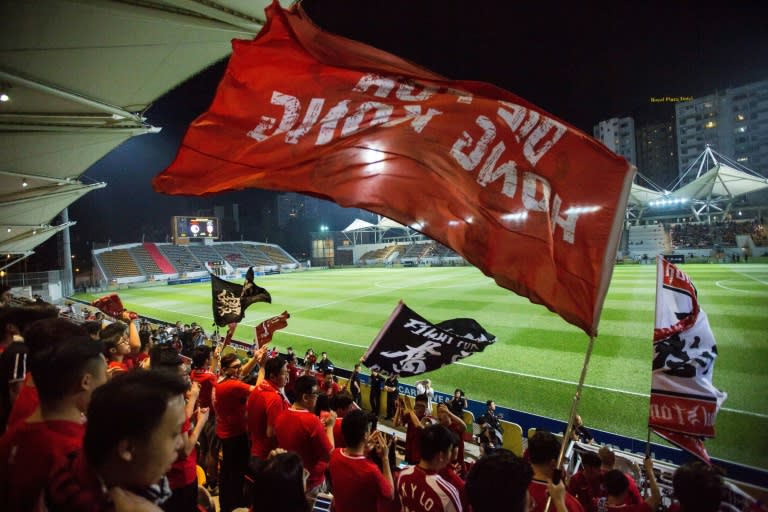 Hong Kong fans fly a flag that says "Die for Hong Kong" before an international friendly football match between Hong Kong and Bahrain at Mong Kok Stadium in Hong Kong on November 9, 2017