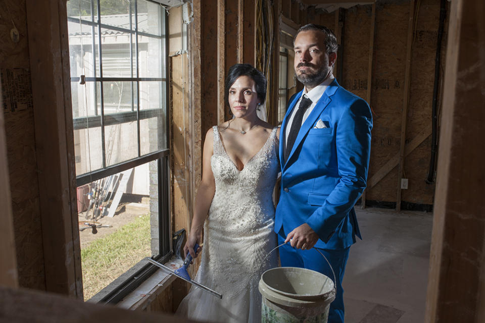 Shellie Schoellkopf and Robert Callaway pose for wedding photos in the Harvey-ravaged home of a friend. (Photo: Bryan Anderson/www.beautyinart.com)