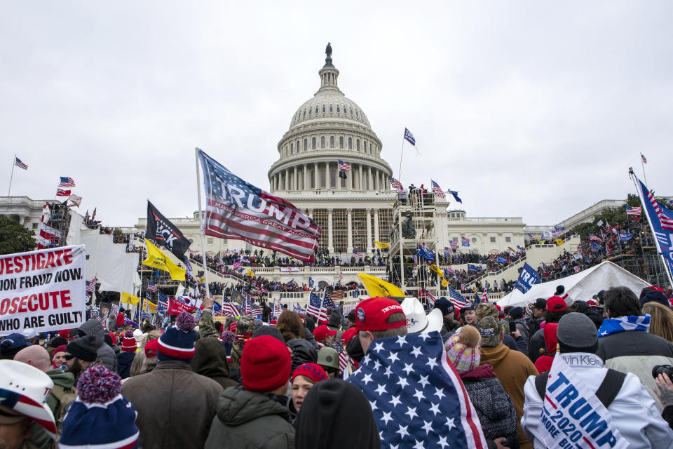 FILE - Rioters loyal to President Donald Trump riot at the U.S. Capitol in Washington on Jan. 6, 2021. Former President Donald Trump said during a debate with President Joe Biden last week that the attack on the Capitol involved a "relatively small" group of people who were "in many cases ushered in by the police." (AP Photo/Jose Luis Magana, File)