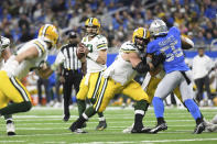 Green Bay Packers quarterback Aaron Rodgers looks downfield during the first half of an NFL football game against the Detroit Lions, Sunday, Jan. 9, 2022, in Detroit. (AP Photo/Lon Horwedel)