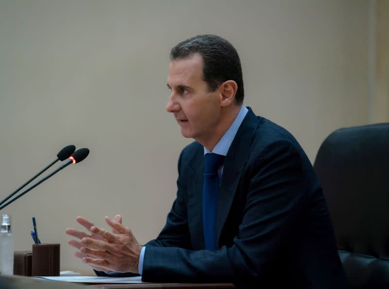 Syrian President Bashar al-Assad addresses the government committee that oversees measures to curb the spread of the coronavirus disease (COVID-19), in Damascus