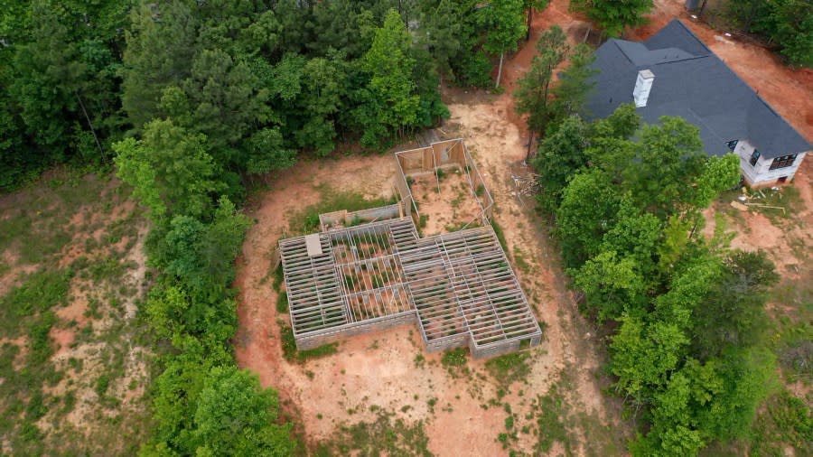 This aerial photograph shows the state of Lisa Labelle’s home build, which was supposed to be completed in April 2024. Labelle fired her builder, Mario Cotto, in January after Labelle said he’d worked two days between their closing date in September 2023 and January 2024. (WJZY Photo/Jack Anderson)