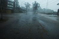 A deserted road is seen ahead of the expected landfall of cyclone Amphan in Digha, West Bengal, on May 20, 2020. - India and Bangladesh began evacuating more than two million people on May 18 as a cyclone barrelled towards their coasts, with officials racing to ready extra shelters amid fears of coronavirus contagion in cramped refuges. (Photo by Dibyangshu SARKAR / AFP) (Photo by DIBYANGSHU SARKAR/AFP via Getty Images)