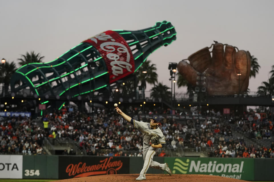 Milwaukee Brewers' Corbin Burnes pitches against the San Francisco Giants during the third inning of a baseball game in San Francisco, Monday, Aug. 30, 2021. (AP Photo/Jeff Chiu)