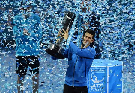 Tennis - Barclays ATP World Tour Finals - O2 Arena, London - 22/11/15 Men's Singles Final - Serbia's Novak Djokovic celebrates with the trophy after winning the Barclays ATP World Tour Finals against Switzerland's Roger Federer Action Images via Reuters / Tony O'Brien Livepic